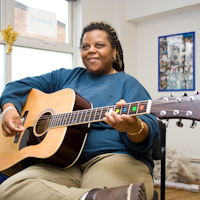 Playing guitar at the music group